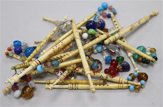 A collection of approximately twenty 19th century named bone and ivory lace bobbins